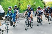 Cyclists riding together in a group on the road